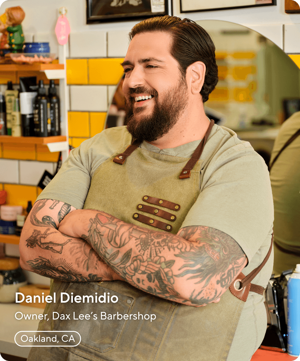 Image of barbershop owner smiling